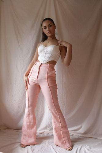 Women’s bright pink baby flares are a 70s influence and a flattering high waist, that elongate the legs while making a bold retro statement. Retro, Vintage wear, Size Inclusive, High-End, Plus -size, Eco-friendly, Organic, Stylish, Classic, Premium, Sacred Circus, Tight-fit, Everyday wear, comfortable, high-quality, flared pants. 